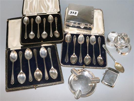 Small silver- cigarette box, vesta case, napkin rings, ashtray and 3 cased sets of spoons